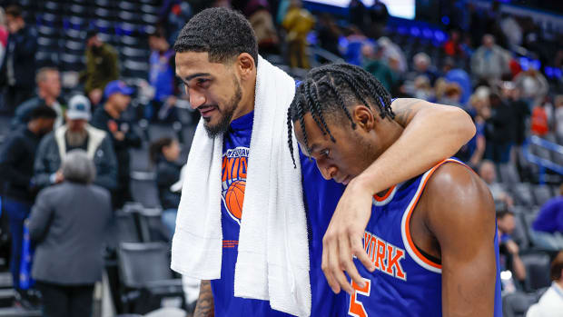 New York Knicks forward Obi Toppin (1) and guard Immanuel Quickley (5) walk off the court.